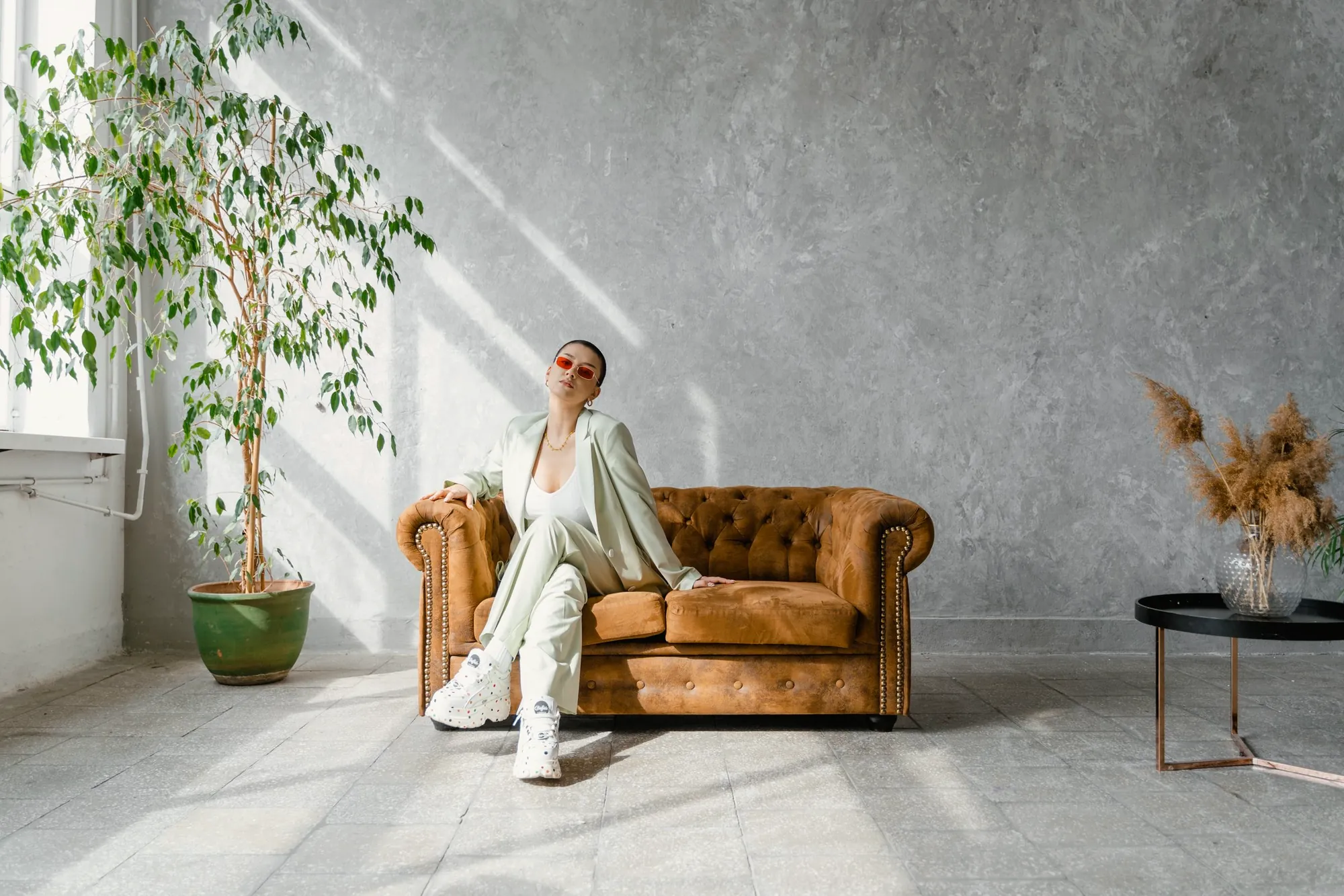 Sunlit loft with a leather chesterfield